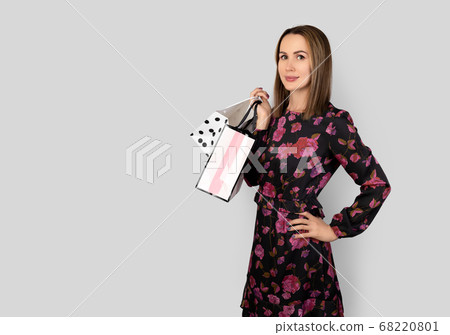 Fashion portrait of pretty woman in floral dress 68220801