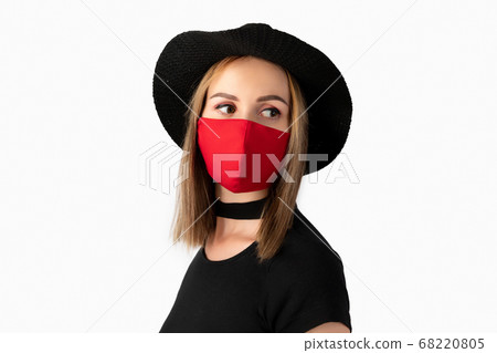 Fashion portrait of beautiful woman in fashionable protective mask Fashion portrait of beautiful woman in fashionable protective mask 68220805