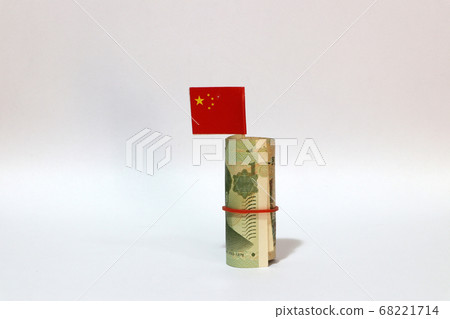 Rolled banknote money one Yuan China and stick with mini Chinese flag on white background.  68221714