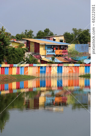 Rainbow village in Indonesia, colorful houses and colorful dam along the canal of slum. 68222081