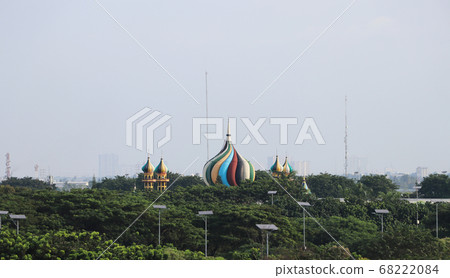 Colorful of mosque roof islamic with green tree and many solar panel. 68222084