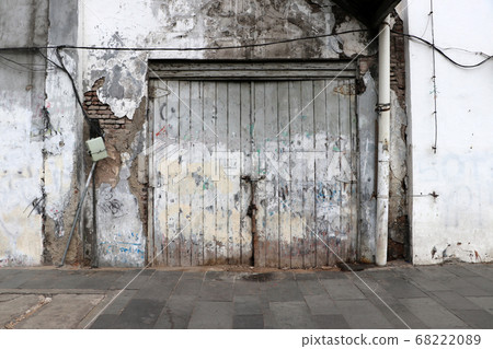 Background of wooden doors and old walls. Background of wooden doors and old walls. 68222089