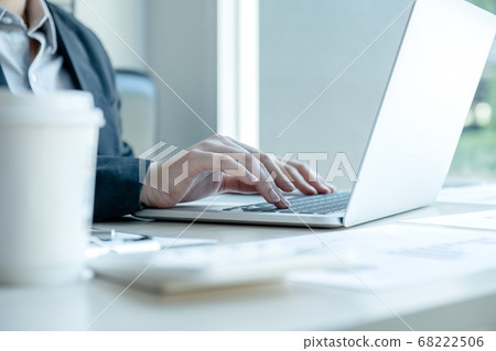 Businesswoman calculating financial graph showing results in the office Businesswoman calculating financial graph showing results in the office 68222506