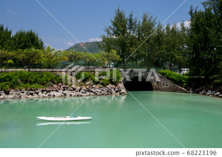 The beach of the Seychelles with blue water and The beach of the Seychelles with blue water and 68223196