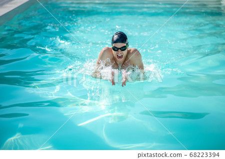 Swimmer with open mouth in water in pool Swimmer with open mouth in water in pool 68223394