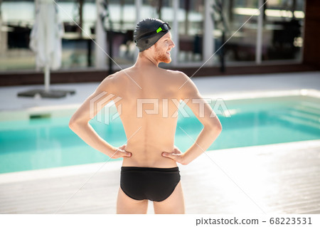 Man standing with his back to camera. Man standing with his back to camera. 68223531