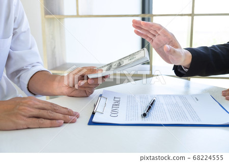 Businessman refusing receive bribe money in the 68224555