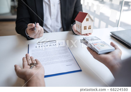 Real estate agent are presenting home loan and 68224580