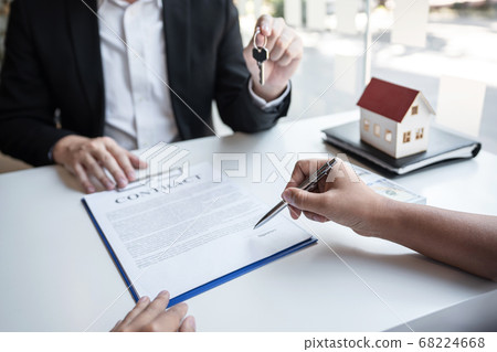 Real estate agent are presenting home loan and 68224668