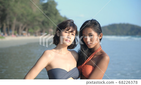 Travel concept. An Asian woman in a bikini is 68226378
