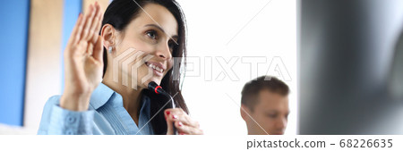 Business woman welcomes interlocutor of conference call Business woman welcomes interlocutor of conference call 68226635