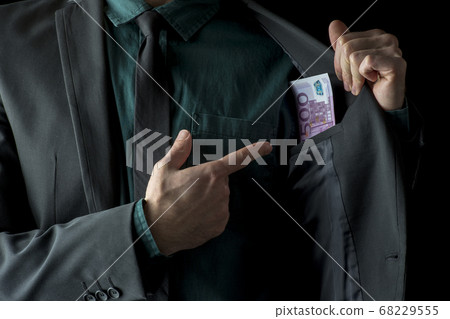 Conceptual image of businessman showing money 68229555