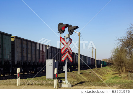 Traffic light and train on the railway Traffic light and train on the railway 68231976