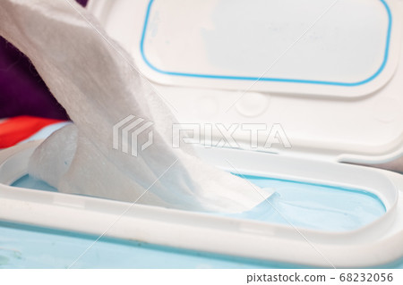 Wet towel wipes out of packaging close up Wet towel wipes out of packaging close up 68232056