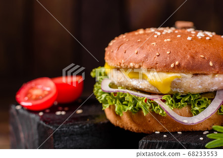 Delicious fresh homemade burger on a wooden table 68233553