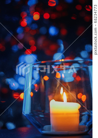 Candle in a glass with a Christmas tree Candle in a glass with a Christmas tree 68234773