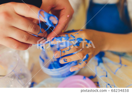 Ingredient for make home made Toy Called Slime, Teenager having fun and being creative homemade slime. Selective focus on Slime. Ingredient for make home made Toy Called Slime, Teenager having fun and being creative homemade slime. Selective focus on Slime. 68234838