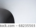 A hole in a white concrete wall. Close up side view 68235503