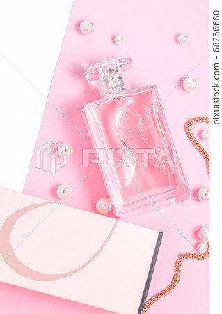 pink perfume bottle with pearls and a gold chain and a box on a pink sheet on a white background copy space. top view, mockup pink perfume bottle with pearls and a gold chain and a box on a pink sheet on a white background copy space. top view, mockup 68236680