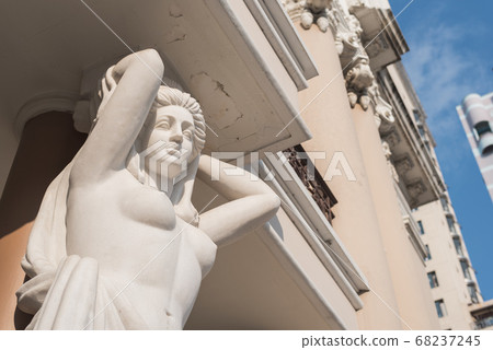 Woman statue of the facade of Municipal Theatre of Ho Chi Minh City (built in 1899). Also known as Saigon Municipal Opera House. Colonial architecture Woman statue of the facade of Municipal Theatre of Ho Chi Minh City (built in 1899). Also known as Saigon Municipal Opera House. Colonial architecture 68237245