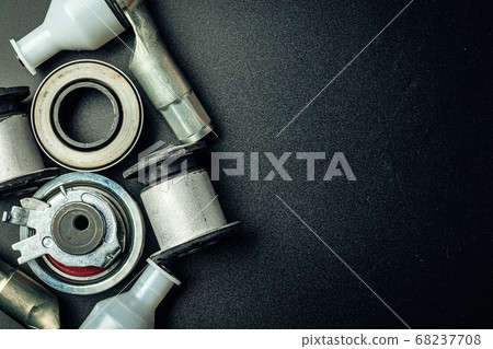 Metal car engine spare part on black background Metal car engine spare part on black background 68237708