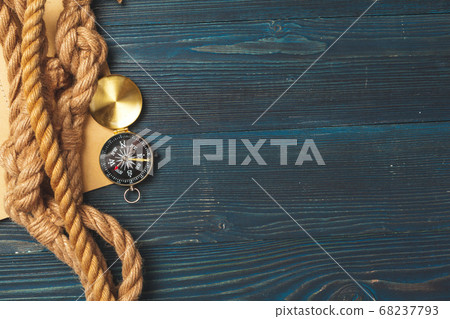 Nautical background. Sailing rope with a compass 68237793