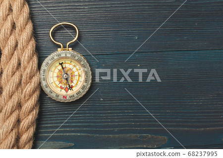 Nautical background. Sailing rope with a compass Nautical background. Sailing rope with a compass 68237995