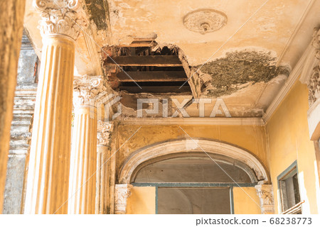 Hole in the plaster ceiling in the Mansion or Villa Bodega, a half-ruined colonial-era building (1910-1920s) in Phnom Penh city center, Cambodia. Hole in the plaster ceiling in the Mansion or Villa Bodega, a half-ruined colonial-era building (1910-1920s) in Phnom Penh city center, Cambodia. 68238773