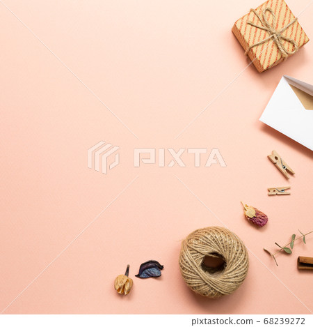 Gift box and card with dry plant on pink background. flat lay, top view, copy space Gift box and card with dry plant on pink background. flat lay, top view, copy space 68239272