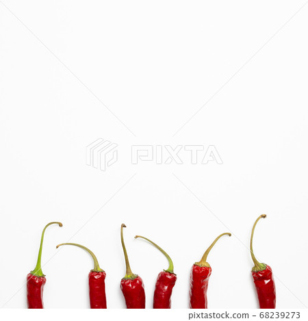 Red hot chilli peppers on white background. flat lay, top view Red hot chilli peppers on white background. flat lay, top view 68239273