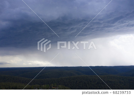 A severe thunderstorm and rain over a valley in The Blue Mountains in Australia 68239733