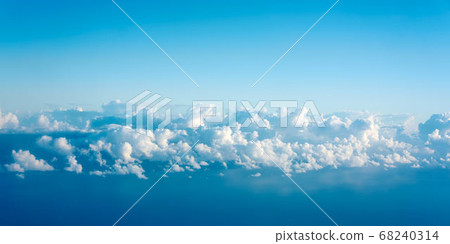 The sky seen through the window of an airplane The sky seen through the window of an airplane 68240314