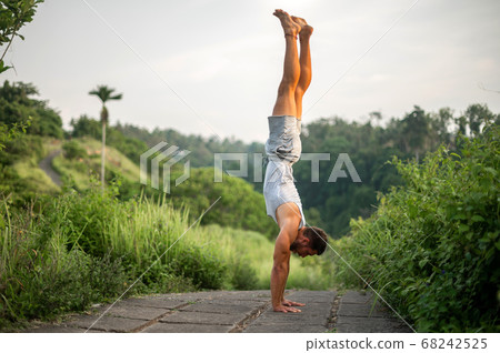 Man practice Yoga practice and meditation outdoor Man practice Yoga practice and meditation outdoor 68242525