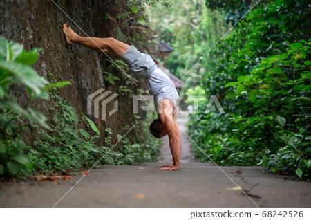 Man practice Yoga practice and meditation outdoor Man practice Yoga practice and meditation outdoor 68242526