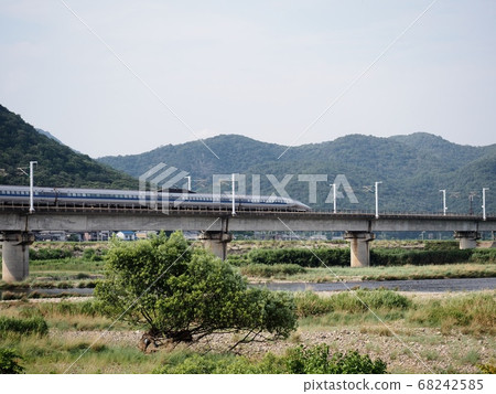 Sanyo Shinkansen 500 series Kodama across the Chikusa River Bridge 68242585
