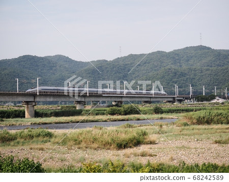 Sanyo Shinkansen 500 series Kodama across the Chikusa River Bridge 68242589