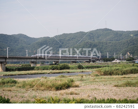 Sanyo Shinkansen 500 series Kodama across the Chikusa River Bridge 68242591