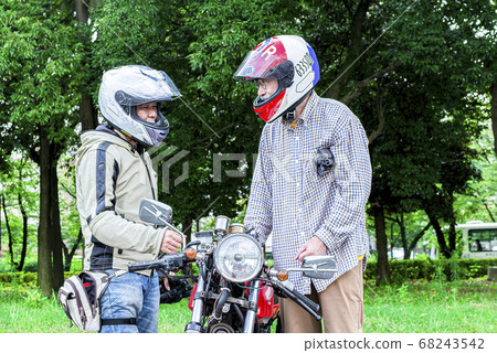 Bike life Senior rider and middle rider learning how to ride a bike Bike life Senior rider and middle rider learning how to ride a bike 68243542