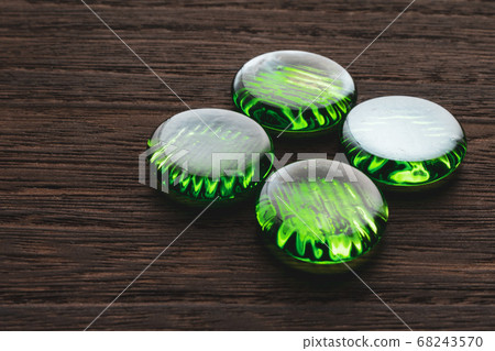Green sardines placed on a brown board Green sardines placed on a brown board 68243570