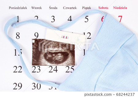 Pregnancy test, ultrasound scan of baby and clothing 68244237