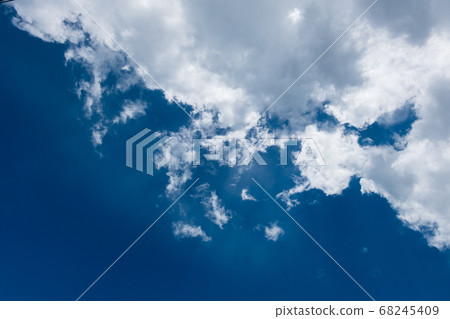 floating white cloud in bright blue sky in sunny day 68245409