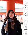 Woman posing at Itsukushima Shrine 68248809