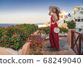 Europe Greece Santorini travel vacation woman on famous santorini Oia island travel destination. Happy young tourist woman. Summer wanderlust. 68249040