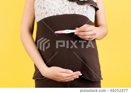 Cropped image of positive pregnancy test with two Cropped image of positive pregnancy test with two 68252877