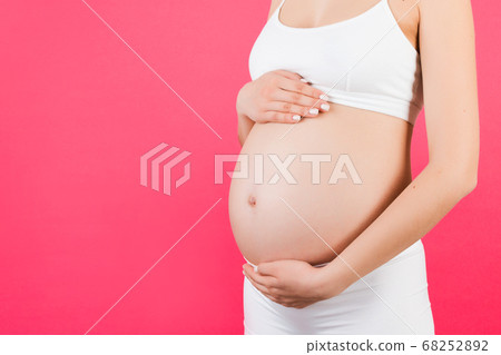 Close up of pregnant woman in white underwear - Stock Photo [68252892] -  PIXTA