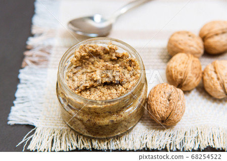 Raw organic walnut butter and fresh nuts. Raw organic walnut butter and fresh nuts. 68254522
