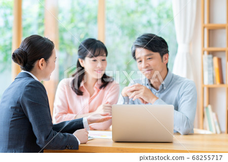 Middle-aged couple consulting on asset management 68255717