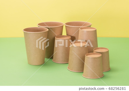 Eco-friendly disposable tableware in yellow and 68256281