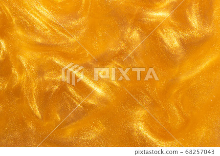 Water with golden paint Water with golden paint 68257043