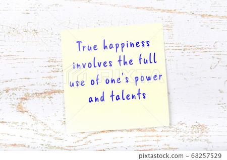 Wise quote on sticky note on wooden wall  68257529